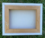 Back of canvas on grass